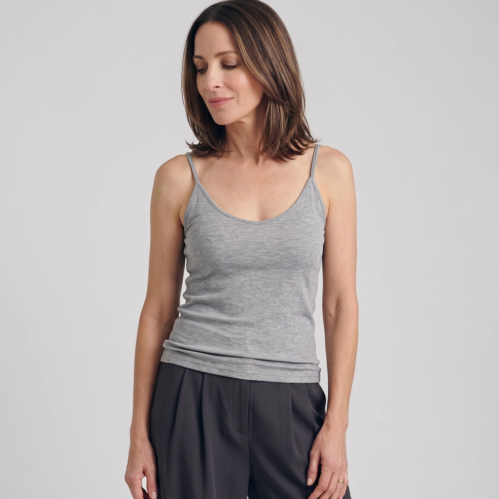 Melange grey ribbed built-in bra camisole with dark grey pleated pants on a light grey background