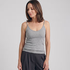 Melange grey ribbed built-in bra camisole with dark grey pleated pants on a light grey background