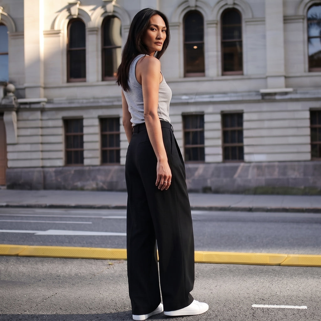 Back view of a melange grey tank top with black tailored pants