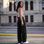Back view of a melange grey tank top with black tailored pants