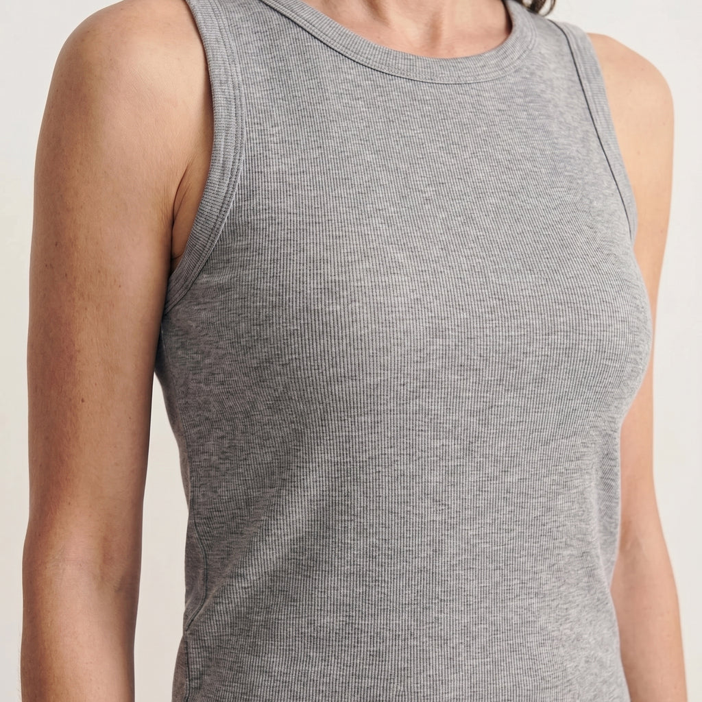 Close-up of melange grey ribbed fabric at the neckline and armhole of the built-in bra tank top