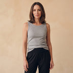 Melange grey ribbed built-in bra tank top with black jogger pants on a warm beige background