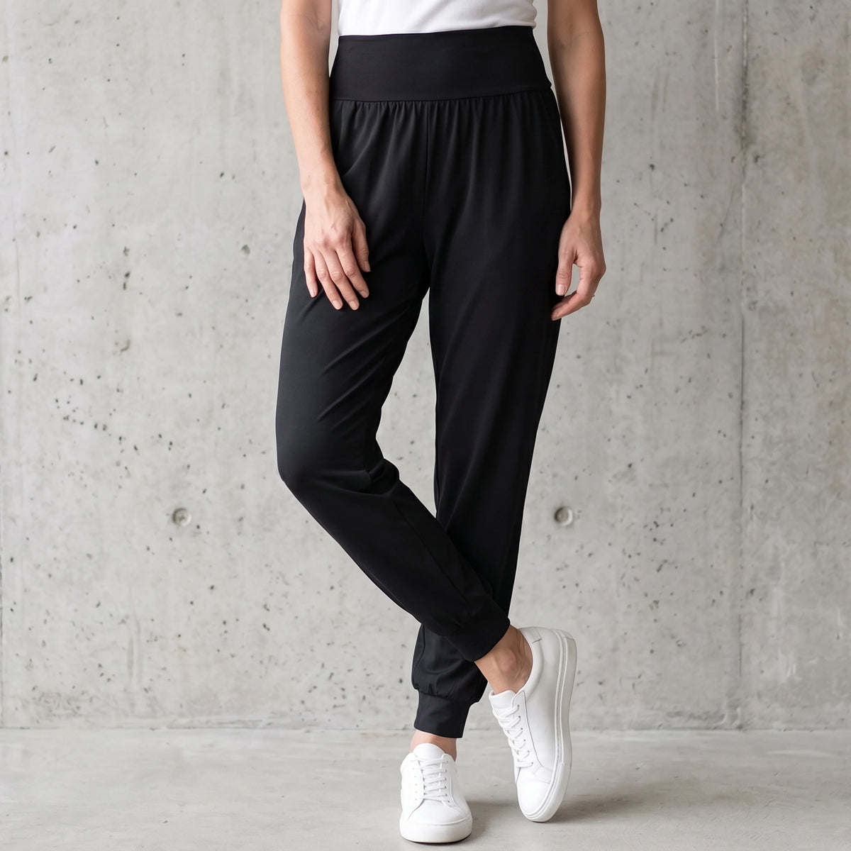 Le monde des hiboux jersey jogger pants in black with a wide high waistband, styled with a white built-in bra camisole